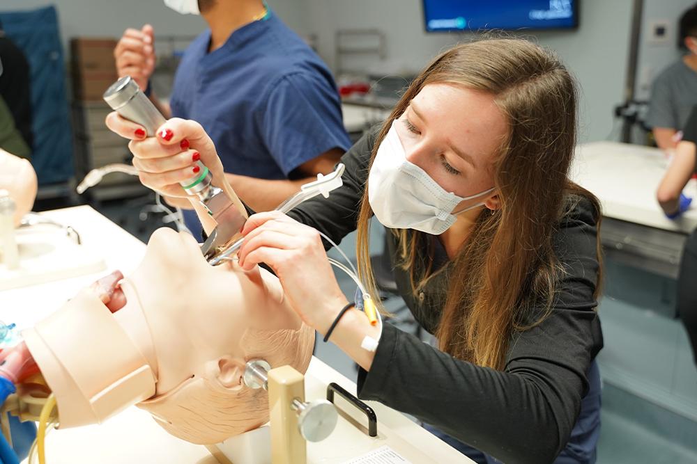 An image of students practicing clinical skills